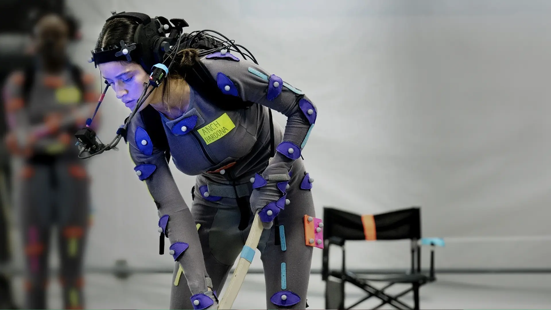 Actress Anya Chalotra in motion capture gear filming a scene from Unknown 9: Awakening.