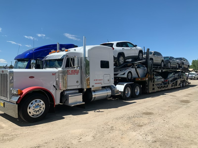An image of a truck hauling vehicles.