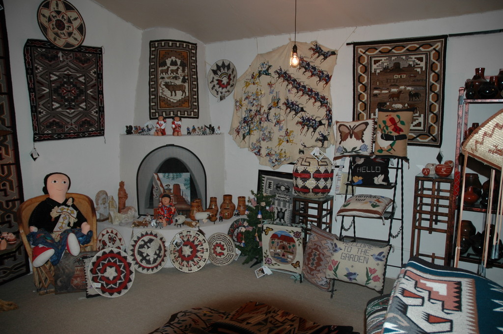 An inside-look at some of the crafts available for purchase. The walls and floor are adorned in Native American crafts.