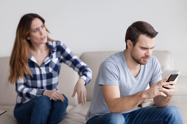 wife angry with busy husband working from home