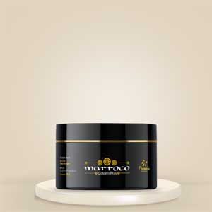Marroco Golden Plus Mask 250g, a black jar containing a nourishing hair mask for deep conditioning and repair with a cream coloured background.
