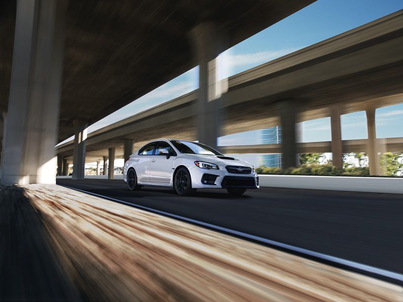 2019 Subaru WRX White Driving Front Quarter ・  Photo by Subaru 