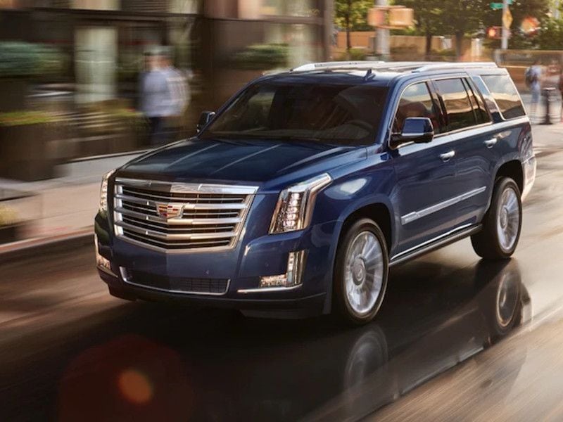 2019 Cadillac Escalade ESV blue driving ・  Photo by General Motors