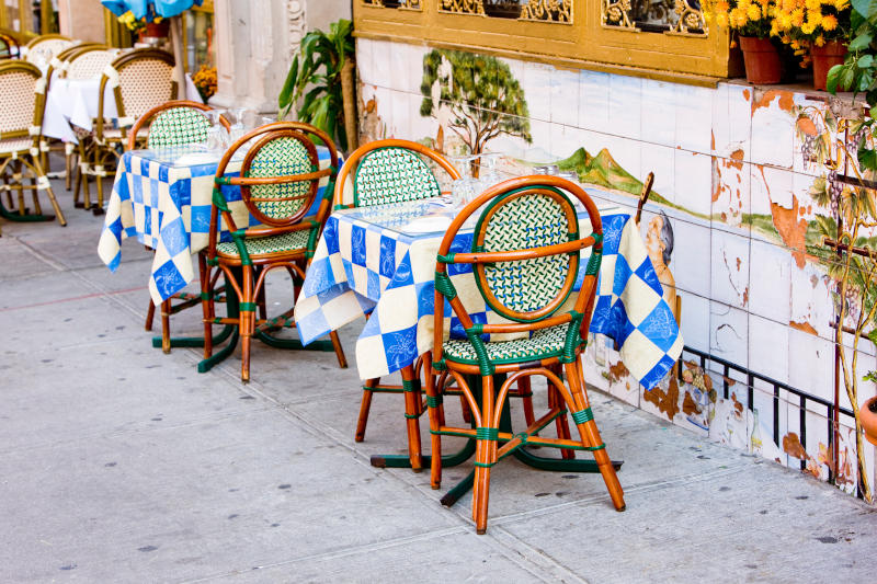 Outdoor seating at a restaurant in Little Italy.