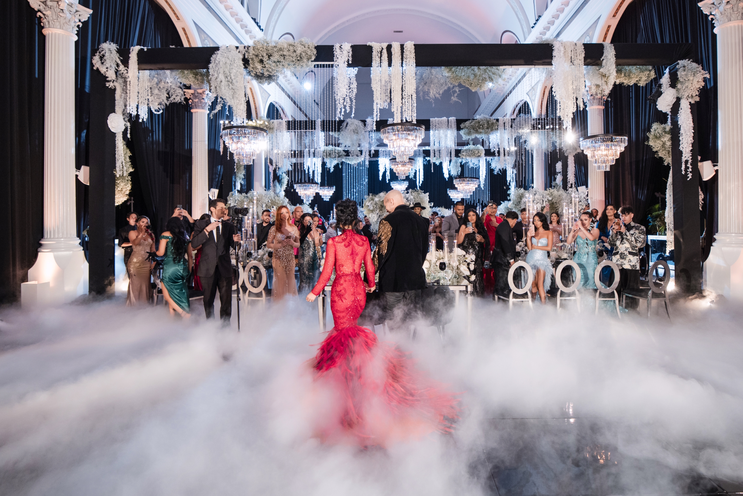 Woman in red dress and man in black tux