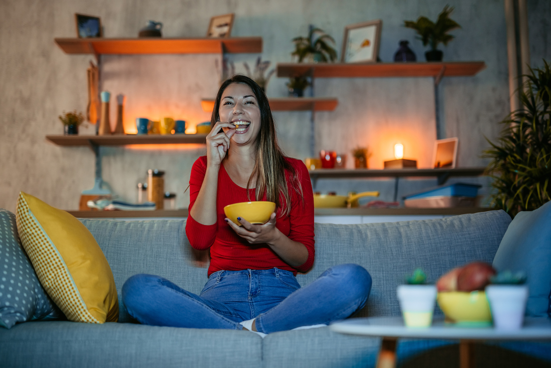 Woman watching funny movie at home.jpg