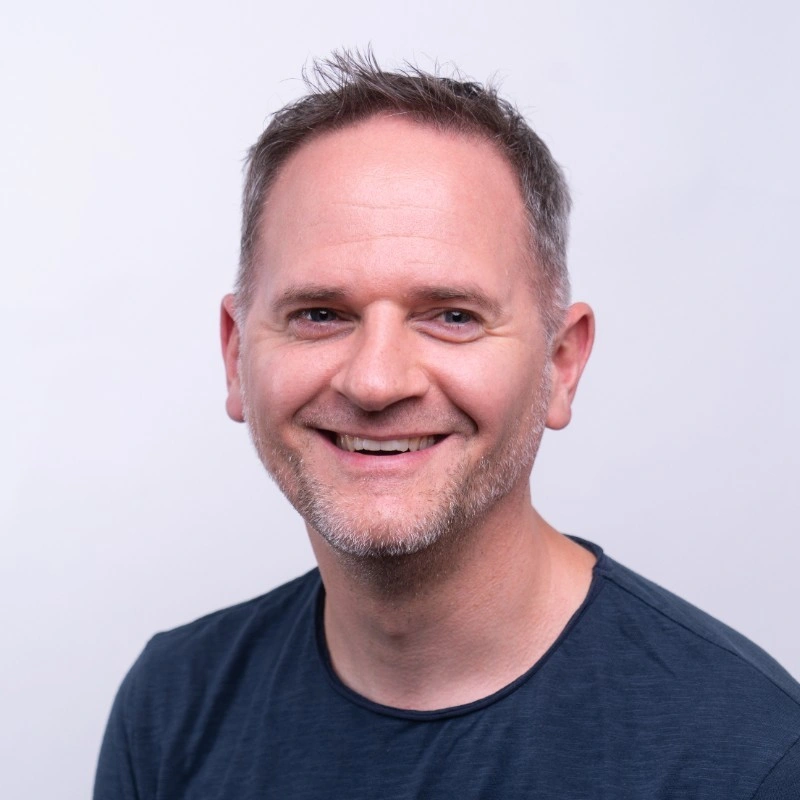 The background of the info card. Likely the portait of a person who is a teacher on the platform.