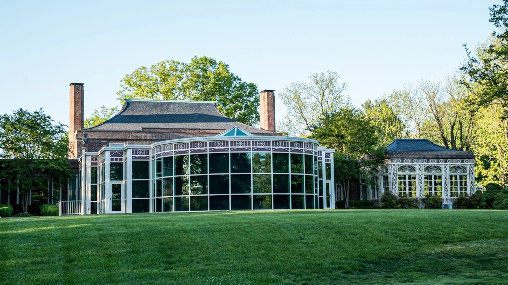 Contemporary glass enclosed artium at Newton White Mansion.
