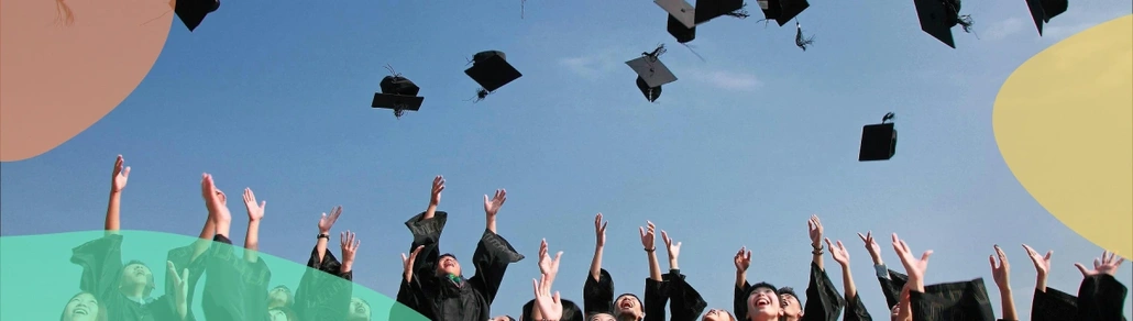 Hands throwing graduation hats