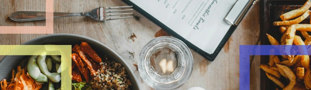 A table with food and the glimpse of the menu 