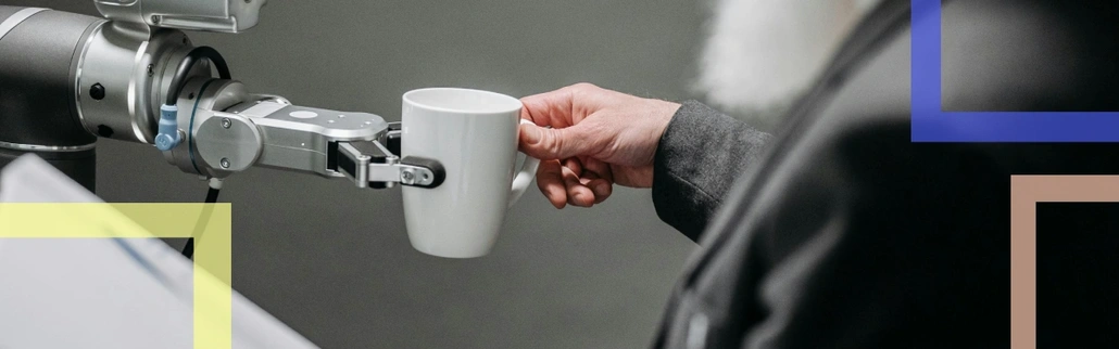 A robot giving a person a cup 