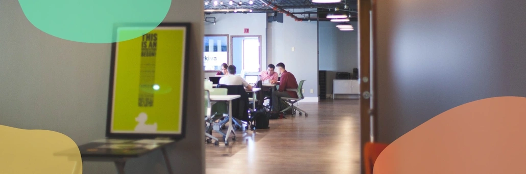 People sitting by the table in the conference room