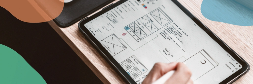 Someone working on a tablet with UX/UI sketch