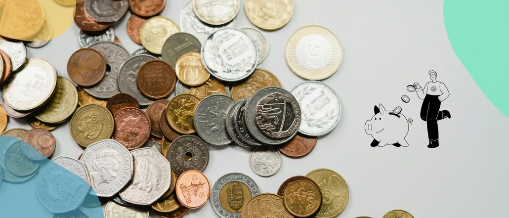 Scattered coint and an icon of a person dropping coins inside of a piggy bank 