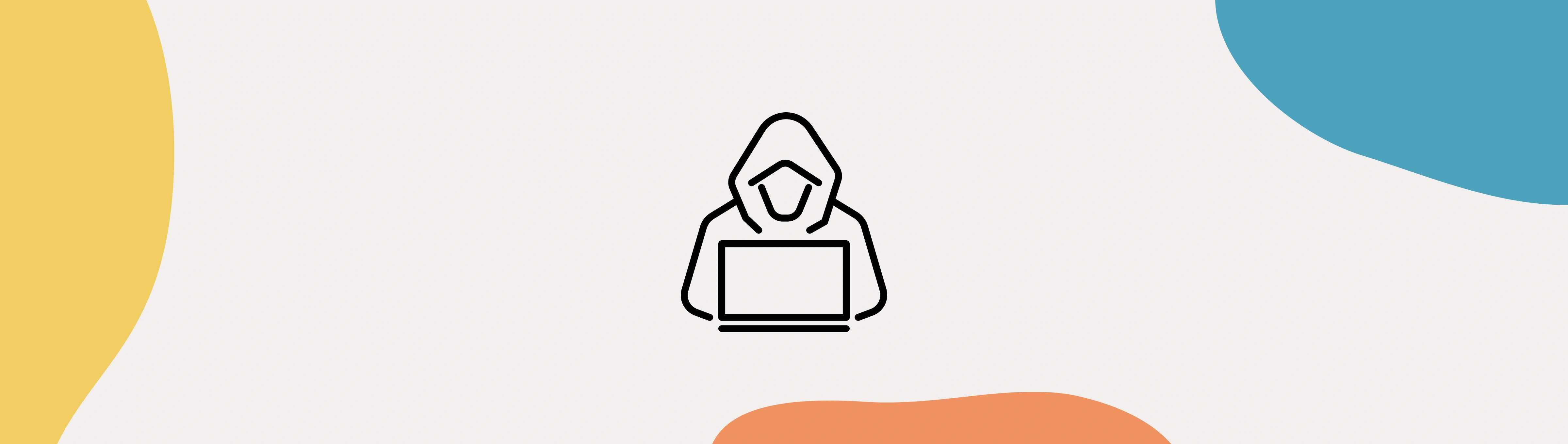 A hooded person working on laptop