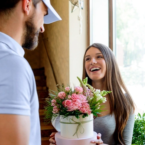 Young girl receives a beautiful, hand delivered flower delivery full of pink flowers.