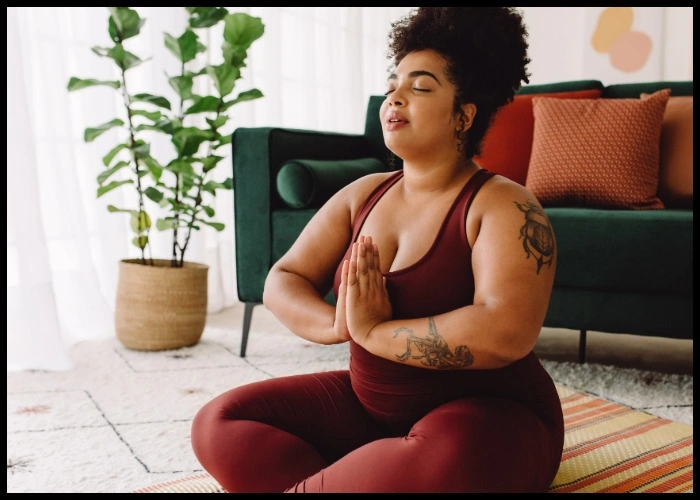 Woman doing yoga and meditating.