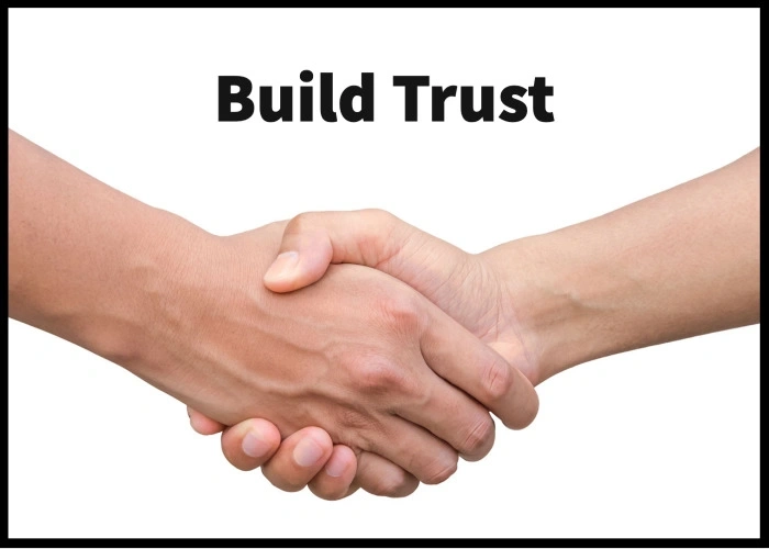 Build trust - Two people shaking hands.
