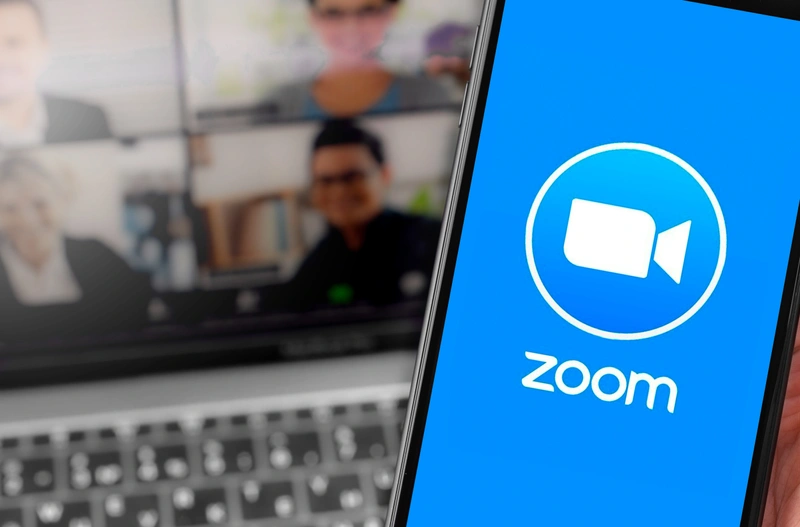 Zoom mobile app and screenshot in background