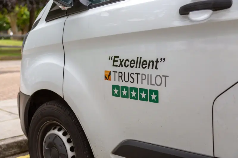 An Excellent Trustpilot rating being advertised on the side of a white van