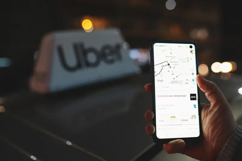 Uber ride and user with app map