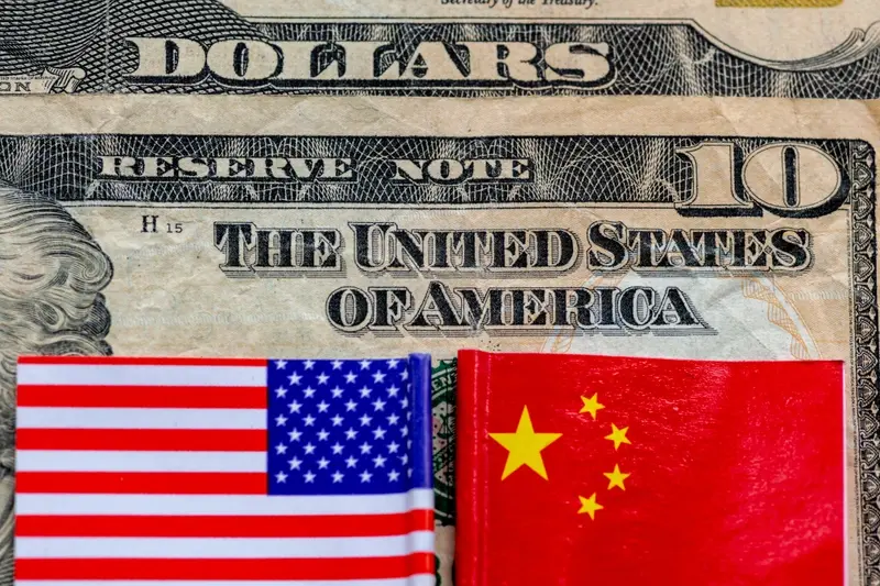 US dollar bill with American & Chinese flags
