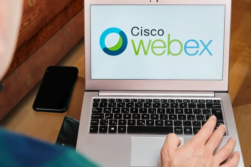 User opening Cisco Webex on laptop