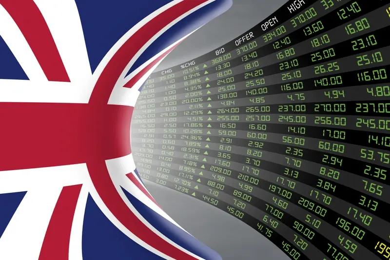 UK flag with stocks flashing green