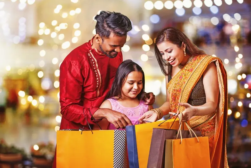 Young Indian family going shopping