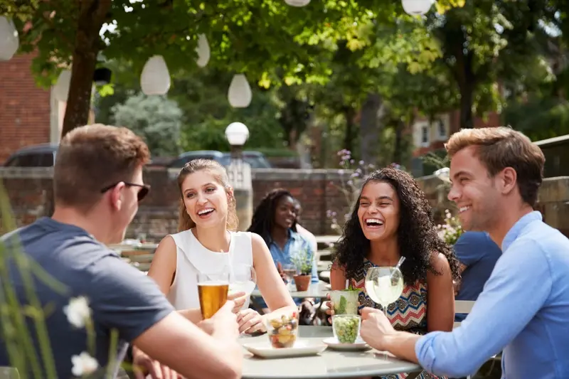 People enjoying a drink in a pub garden