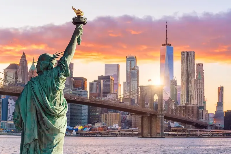 Statue of Liberty & Brooklyn Bridge overlooking downtown New York