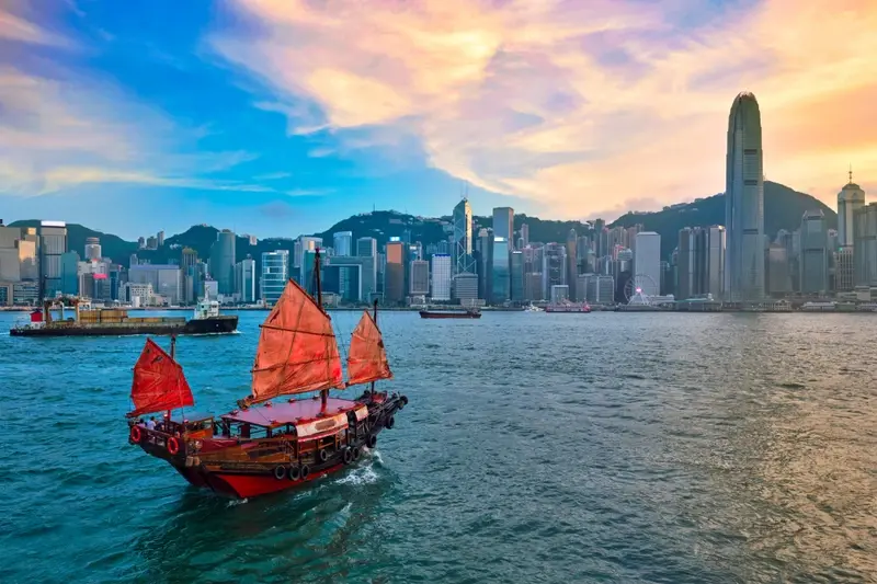Image of old fashioned boat against Chinese skyline
