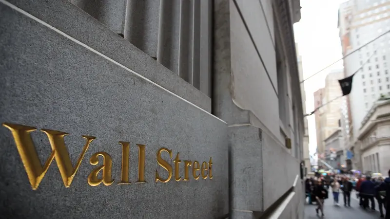 Wall Street sign on brick wall