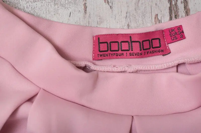 Pink label on Boohoo clothes