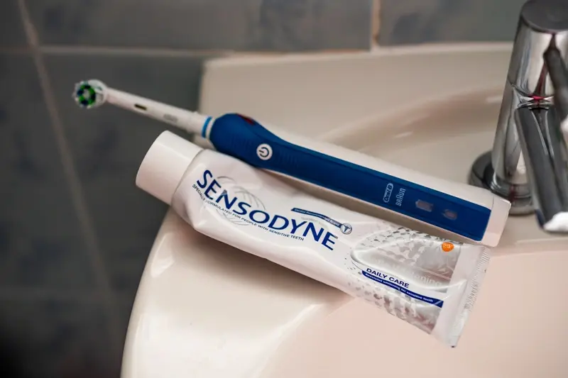 Sensodyne toothpaste and an electric toothbrush