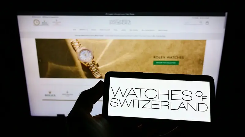 Watches of Switzerland logo on a smartphone