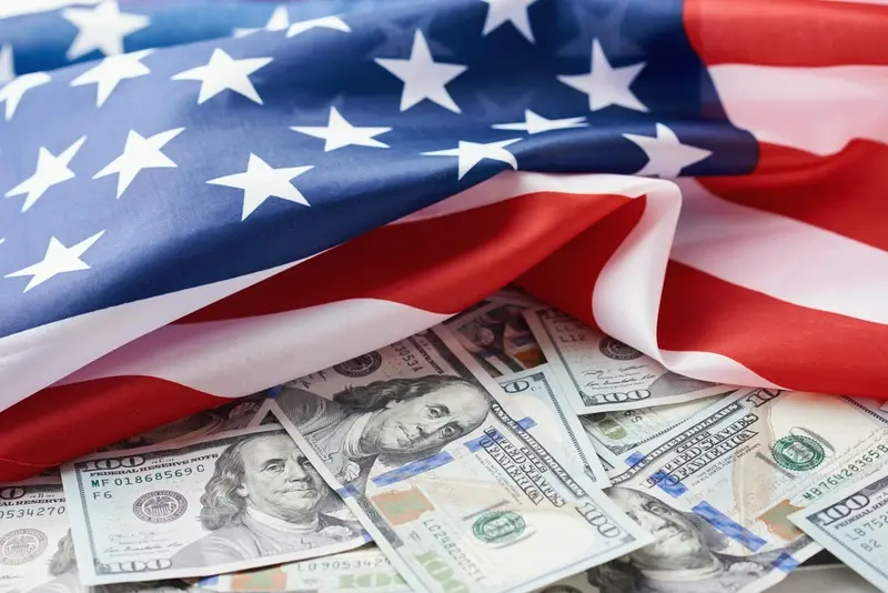 US flag and dollar bills