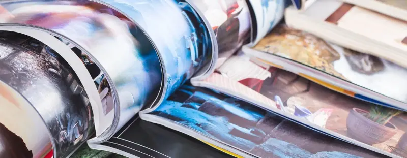 Pile of open magazines