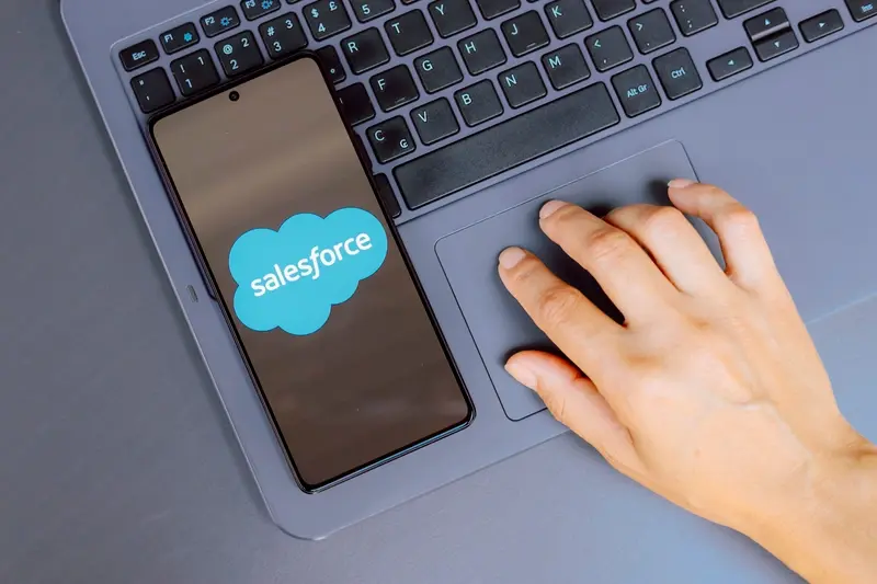 Agent using Salesforce on mobile and laptop