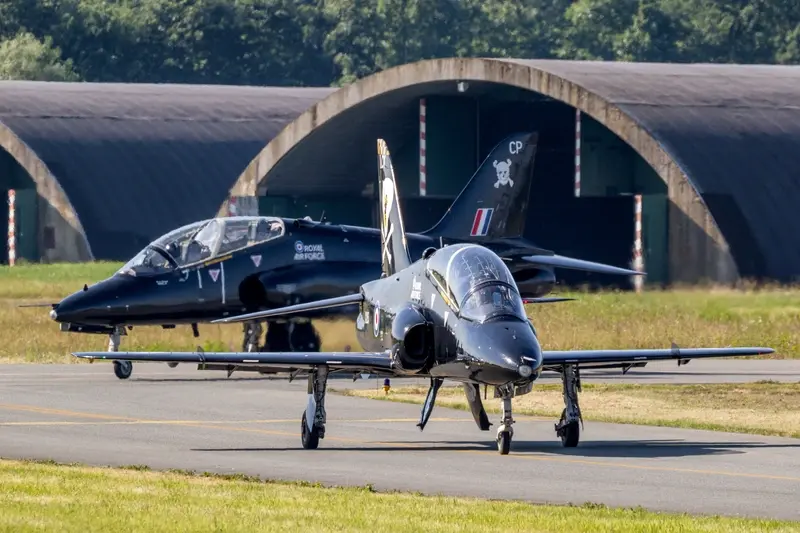 Force BAE Hawk T1 trainer jets taxiing to the runway of Florennes airbase.