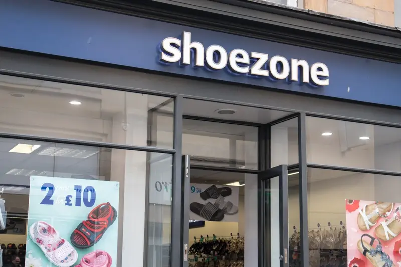 A picture of the front of a Shoezone store