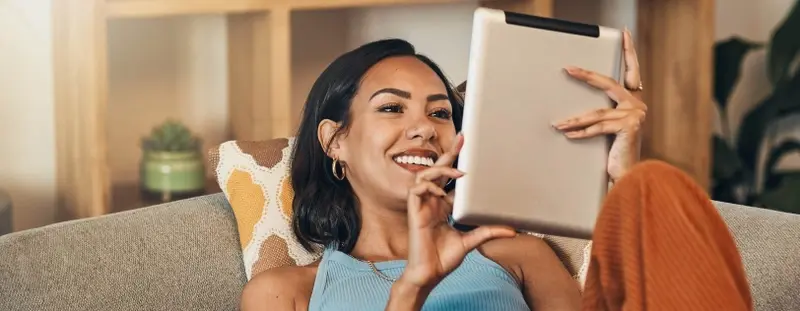 Woman reading news on tablet