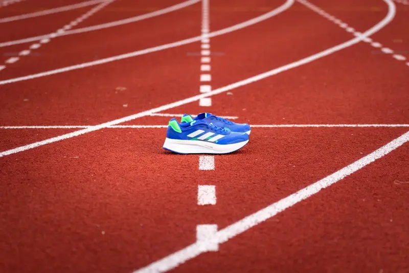 Adidas running shoe on track