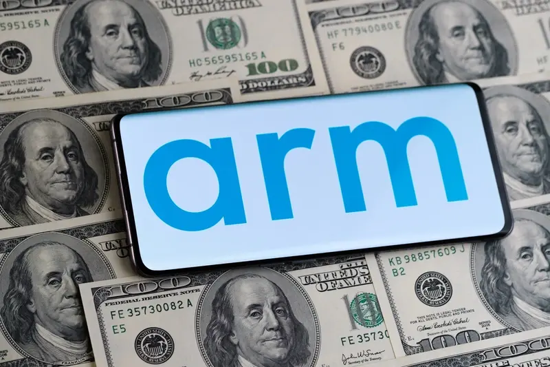 Arm corporate branding on mobile against dollars