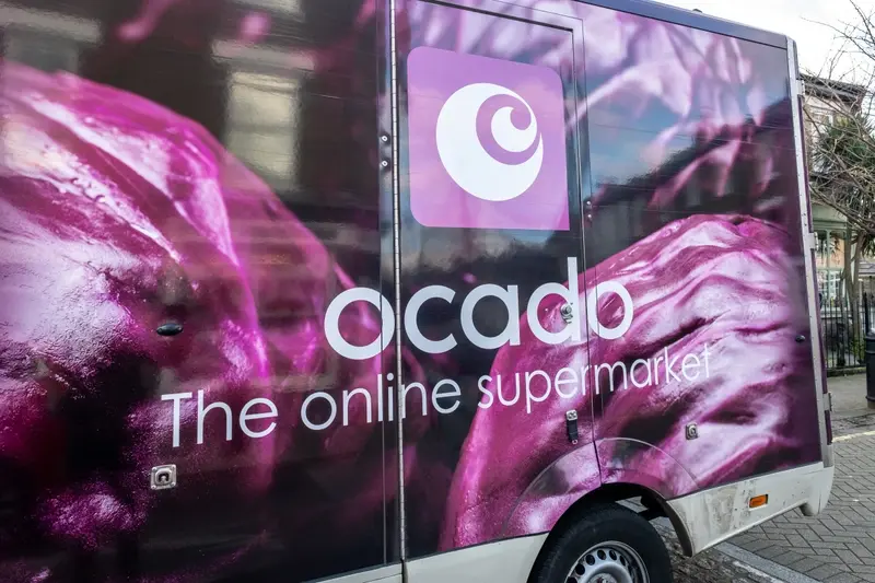 Side of Ocado truck with purple veg imagery
