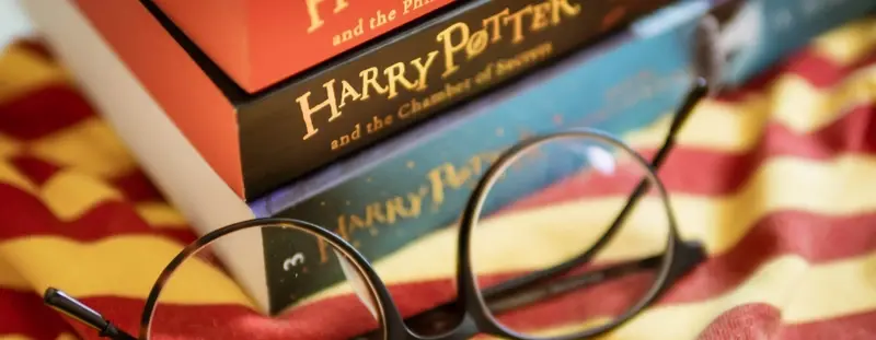 Harry Potter book and glasses