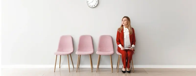 Lady sitting in a queue waiting for an interview