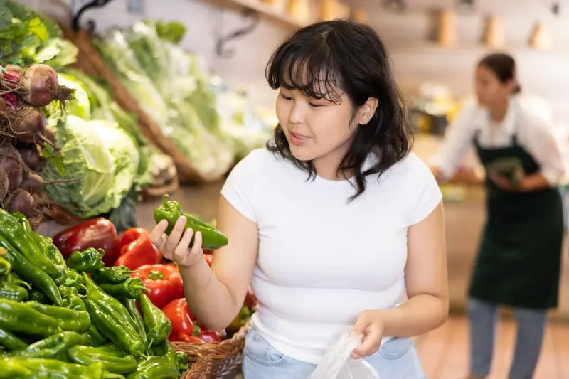 Chinese lady shopping for vegetables