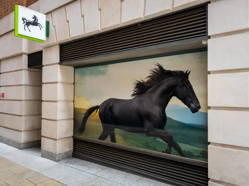 Lloyds galloping black horse in window