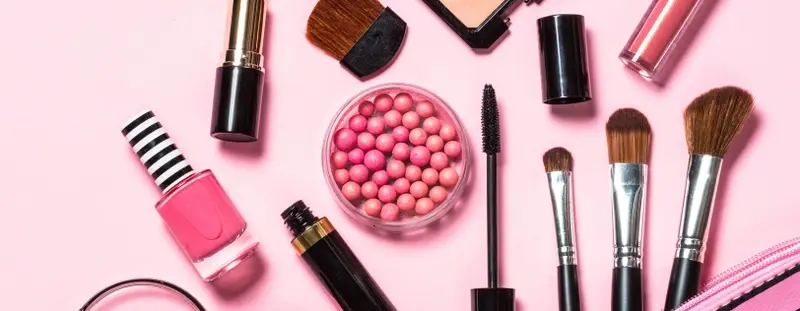 Cosmetic products on a pink background